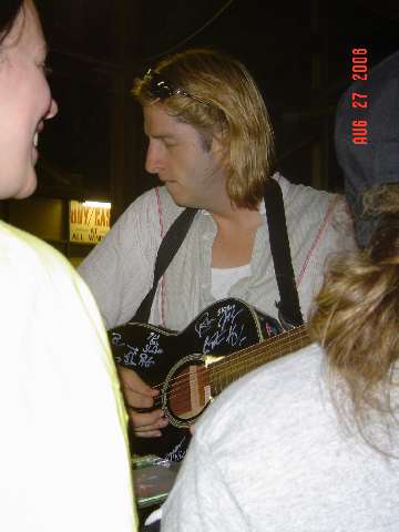 Karl playing a fan's guitar